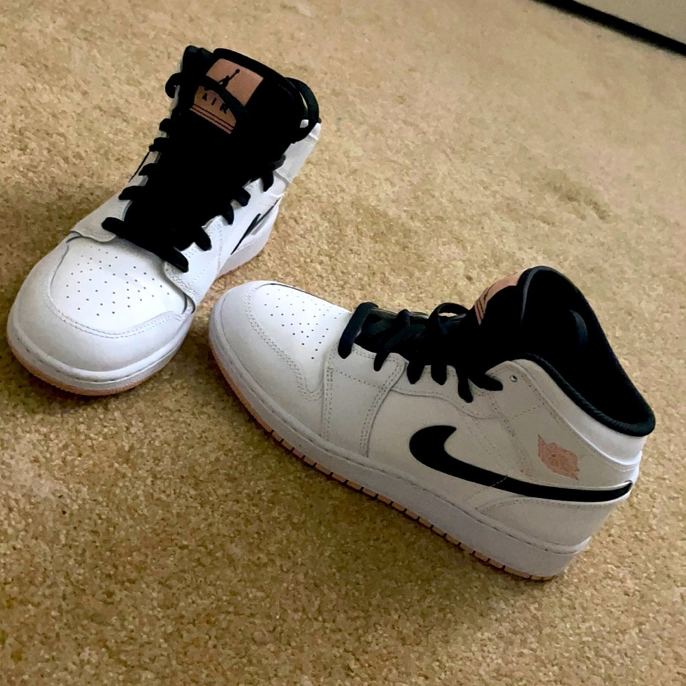 Black and white Jordan’s mid 1